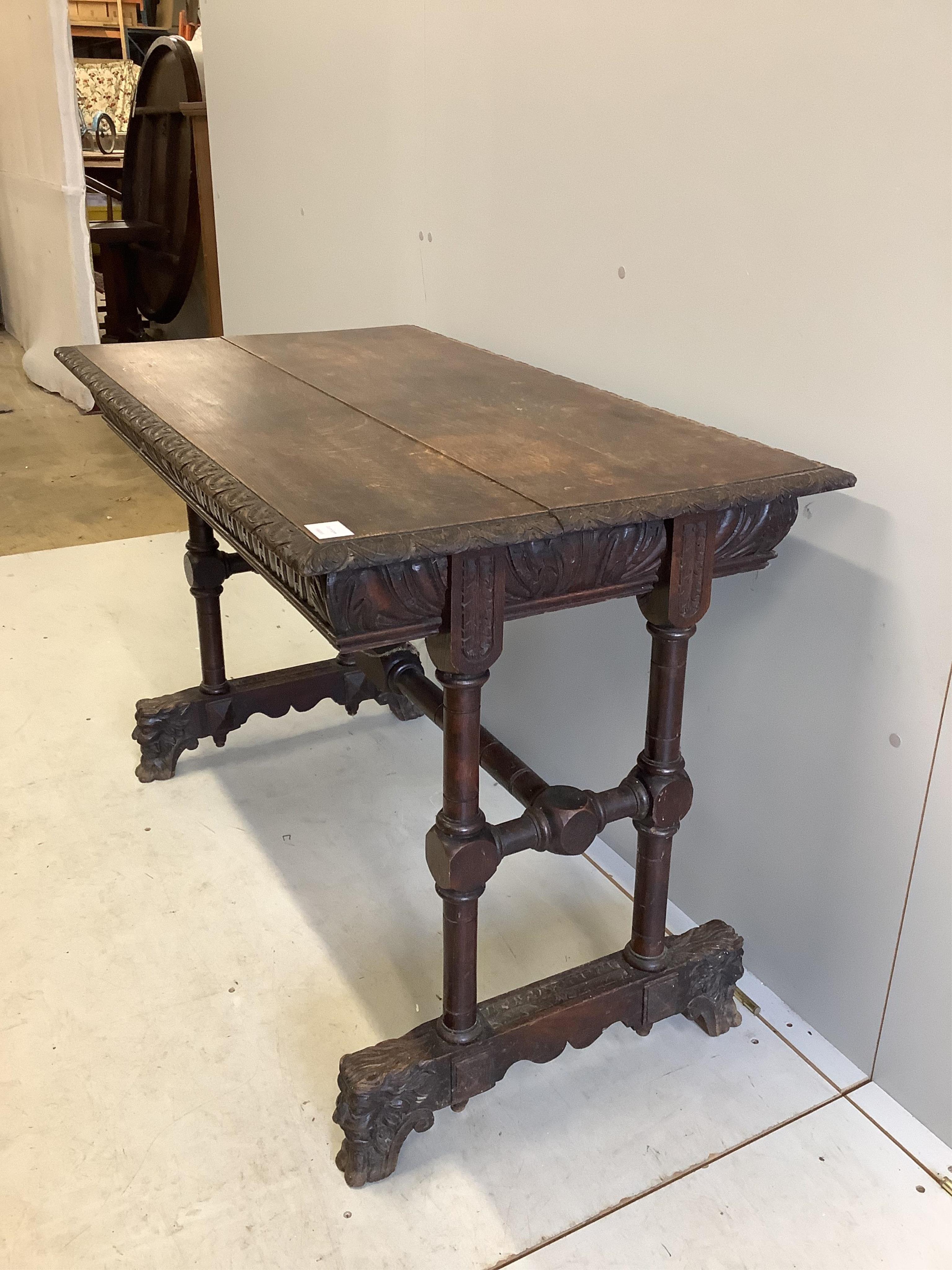 A late Victorian Flemish carved oak side table, width 108cm, depth 62cm, height 75cm. Condition - fair